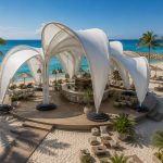 Contemporary sculptural shade structure overlooking a beachfront resort.