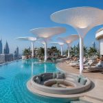 Organic architectural shade structure installed on a rooftop hospitality terrace.