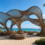 Contemporary sculptural shade structure overlooking a beachfront resort.